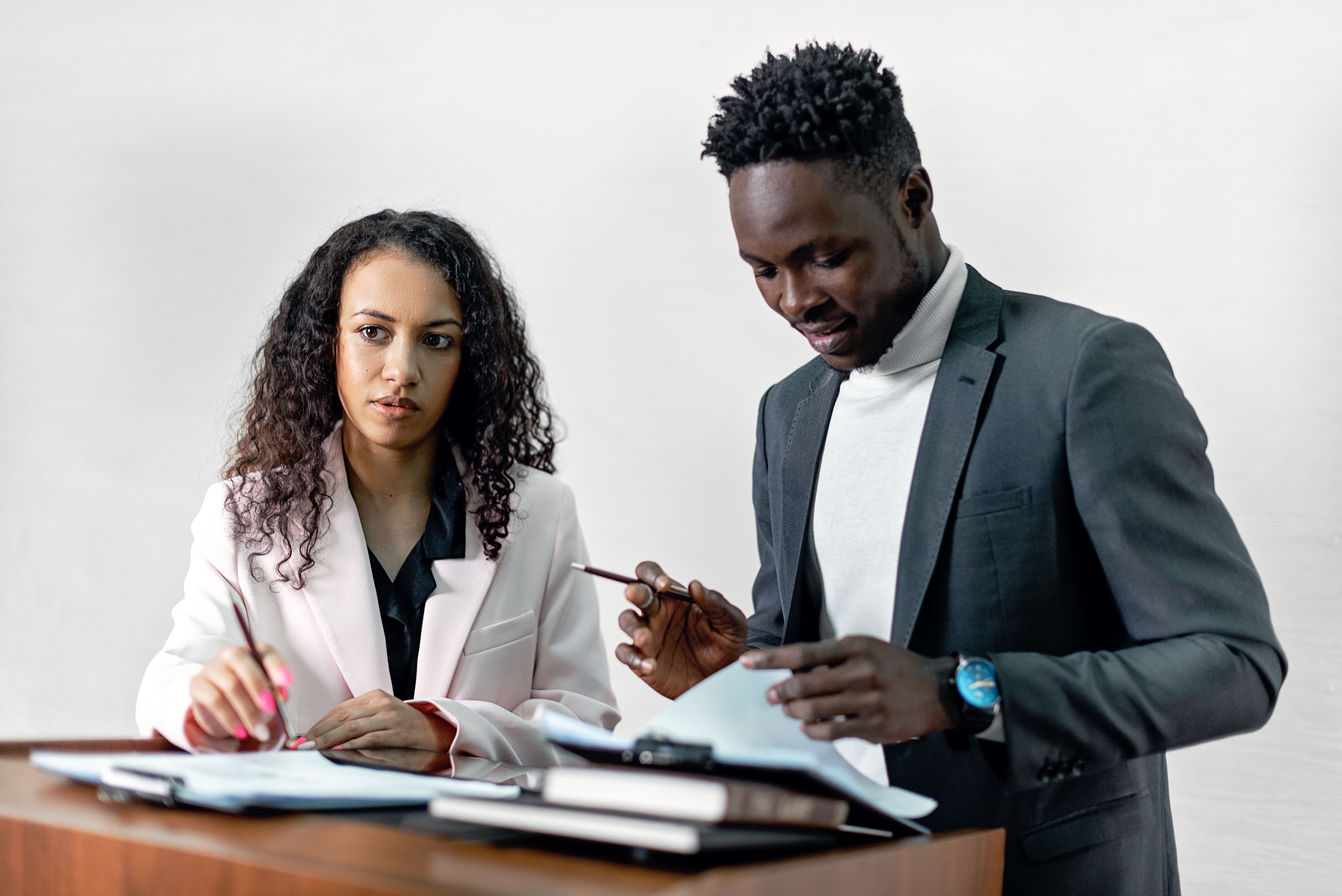 Investment professionals reviewing documents